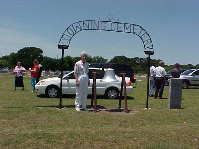 Aline Jones at the entrance to Downing Cemetery, May 2006